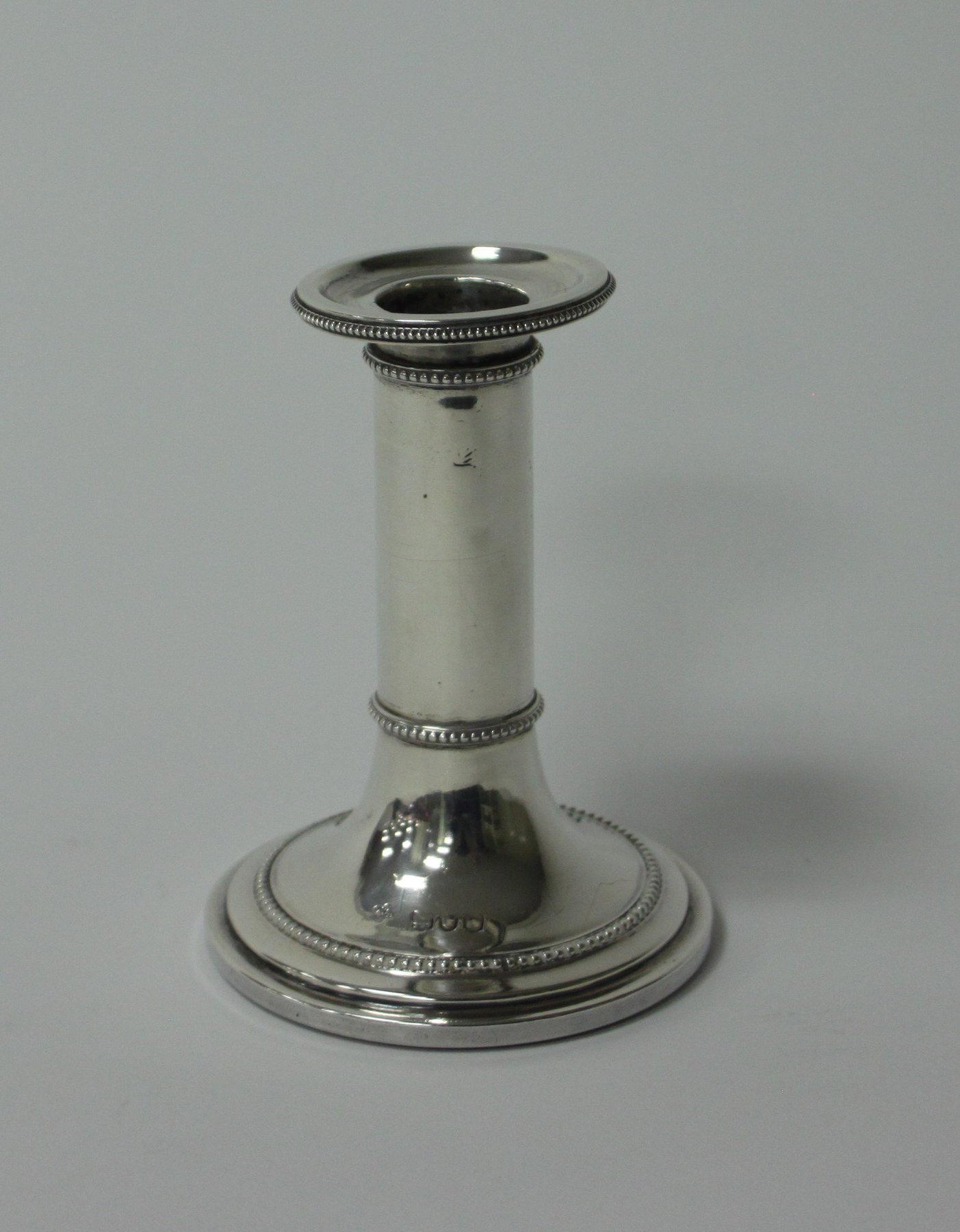 Appraisal: A silver desk candlestick marks rubbed circa of plain circular