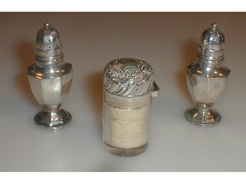 Appraisal: An Edwardian silver topped smelling salts bottle and a pair