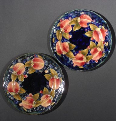 Appraisal: Pomegranate' a pair of Moocroft Pottery plates designed by William