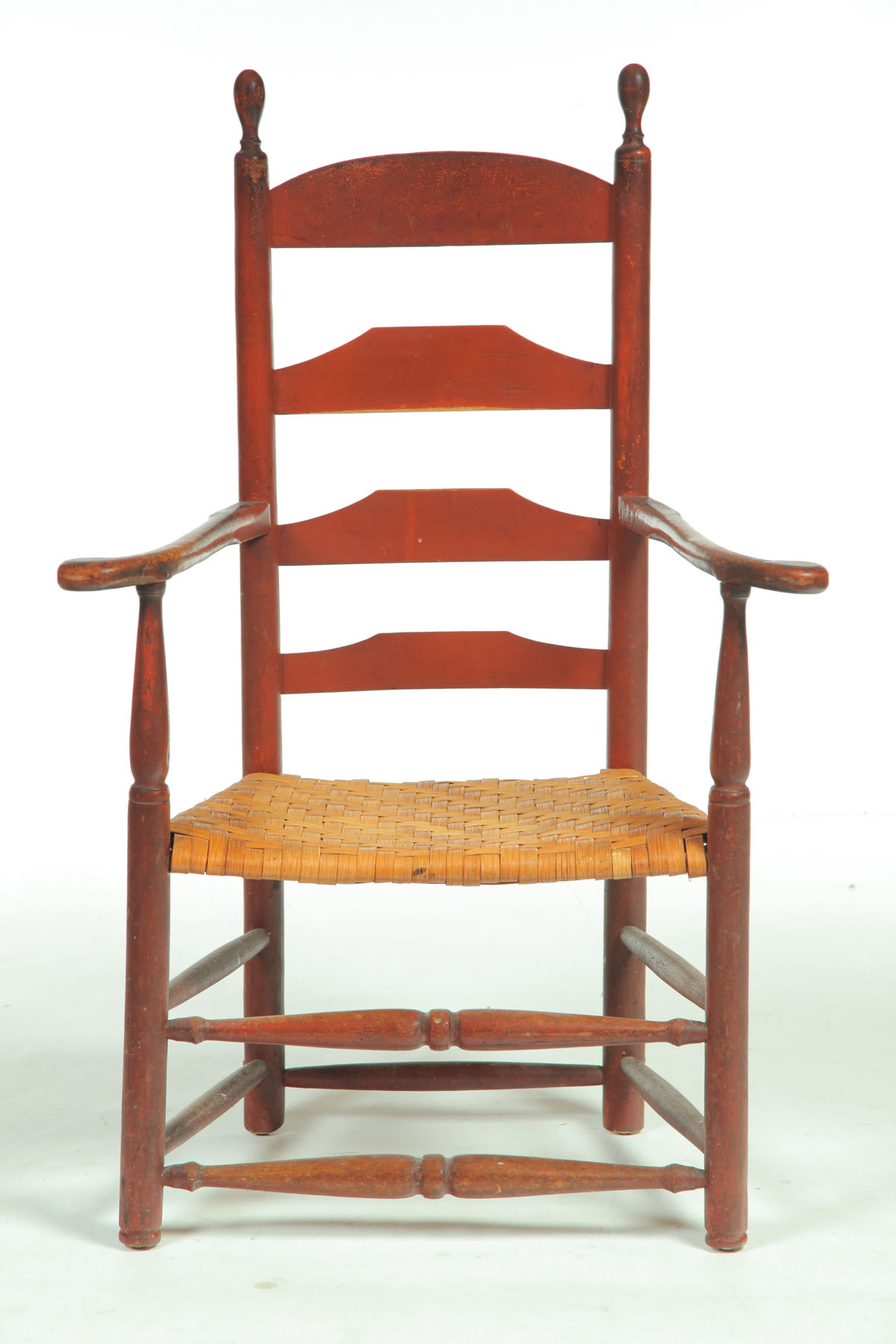 Appraisal: LADDERBACK ARMCHAIR New England th century maple Arched slat over