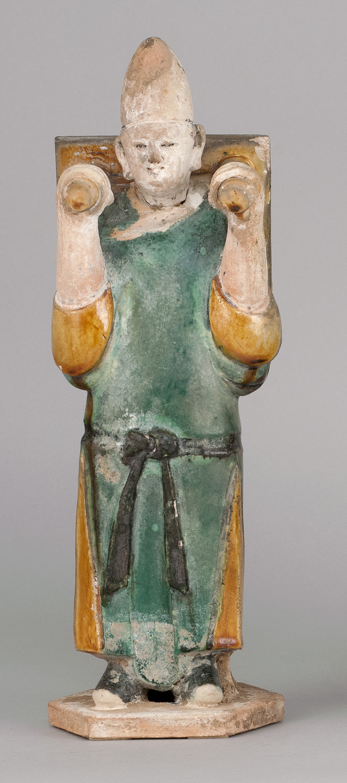 Appraisal: POTTERY FIGURE OF AN ATTENDANT Ming DynastyIn standing position carrying