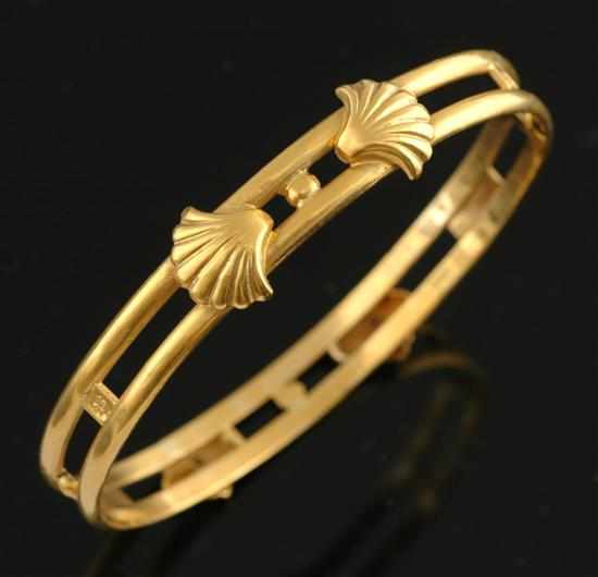 Appraisal: A gold bangle Decorated with raised shell design all in