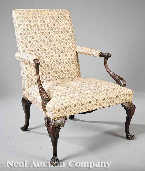 Appraisal: An Antique Chippendale-Style Carved Mahogany Library Chair scrolled carved and