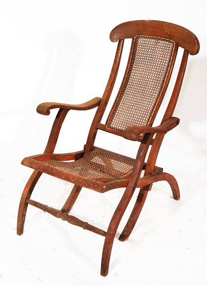 Appraisal: A FOLDING WOODEN STEAMER GARDEN CHAIR caned back and seat