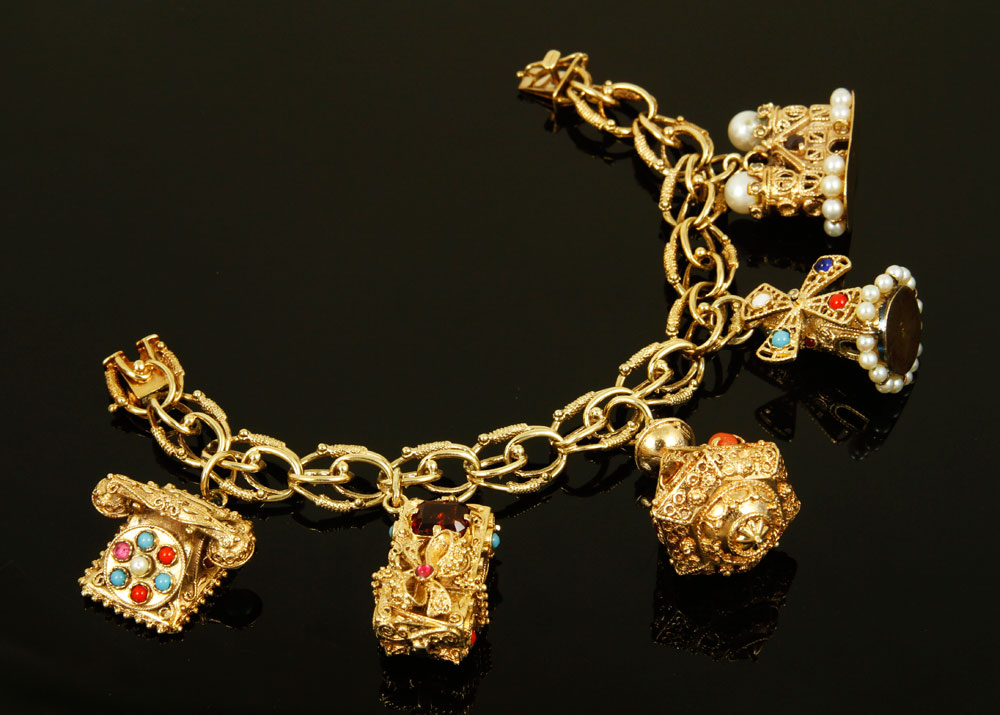 Appraisal: A - K Gold Charm Bracelet K yellow gold charm