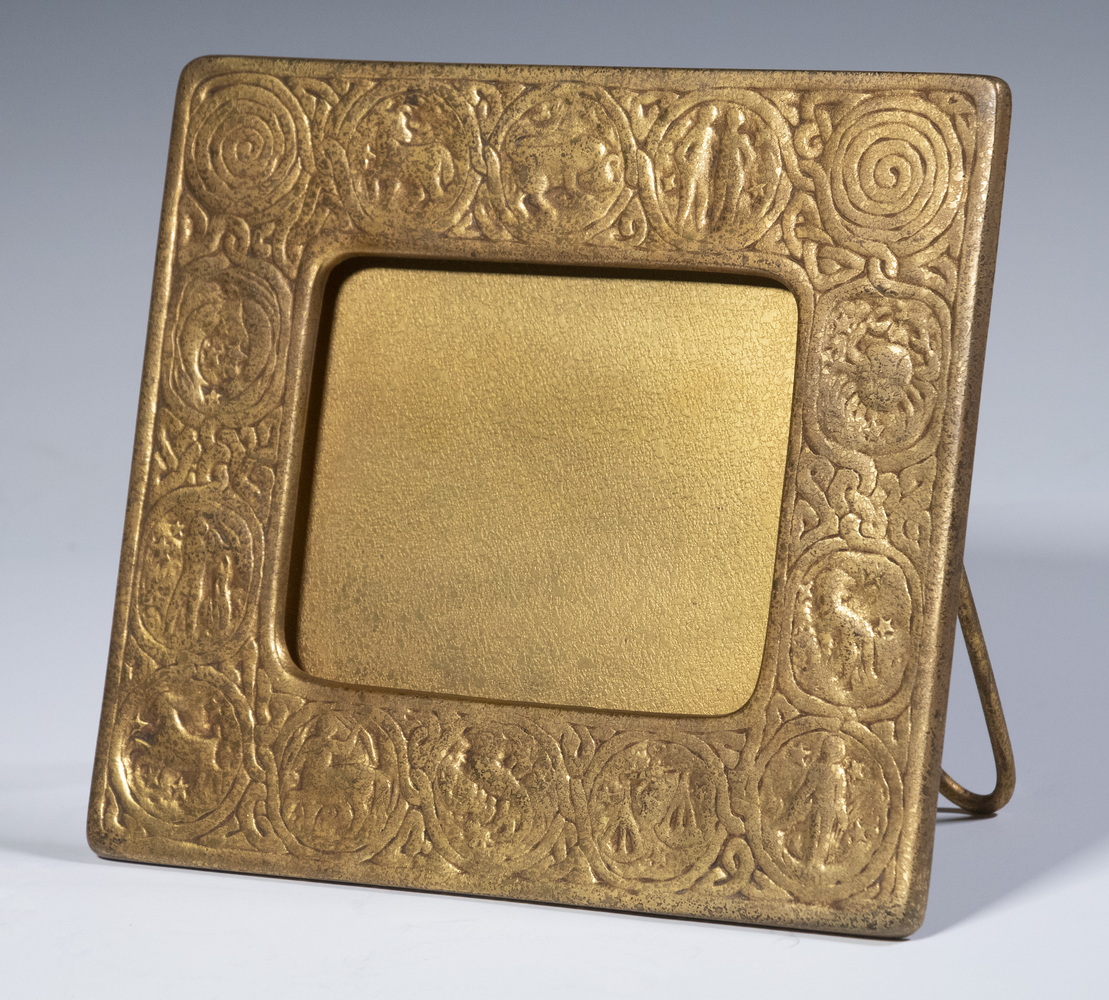 Appraisal: TIFFANY STUDIOS ZODIAC CALENDAR FRAME Early th c Gilt Bronze