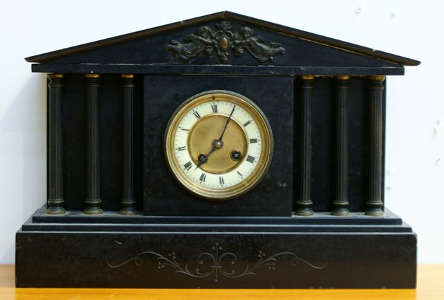 Appraisal: A French late th century black slate mantle clock of