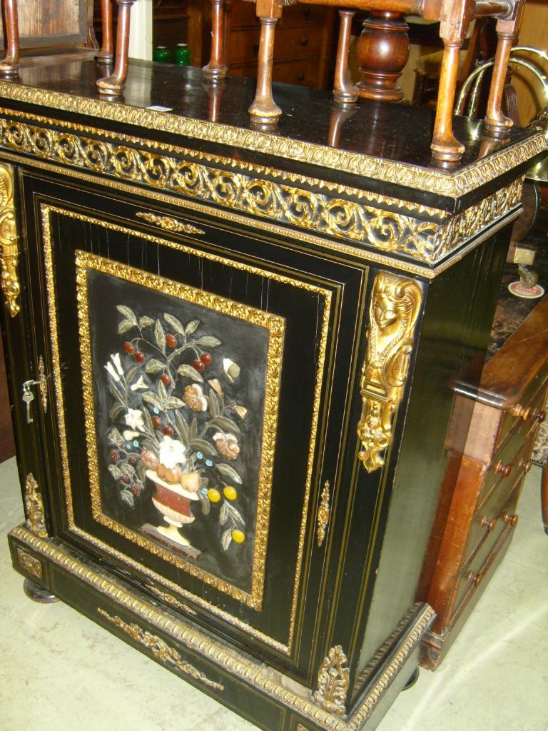 Appraisal: A Victorian ebonised side cabinet enclosed by a single door