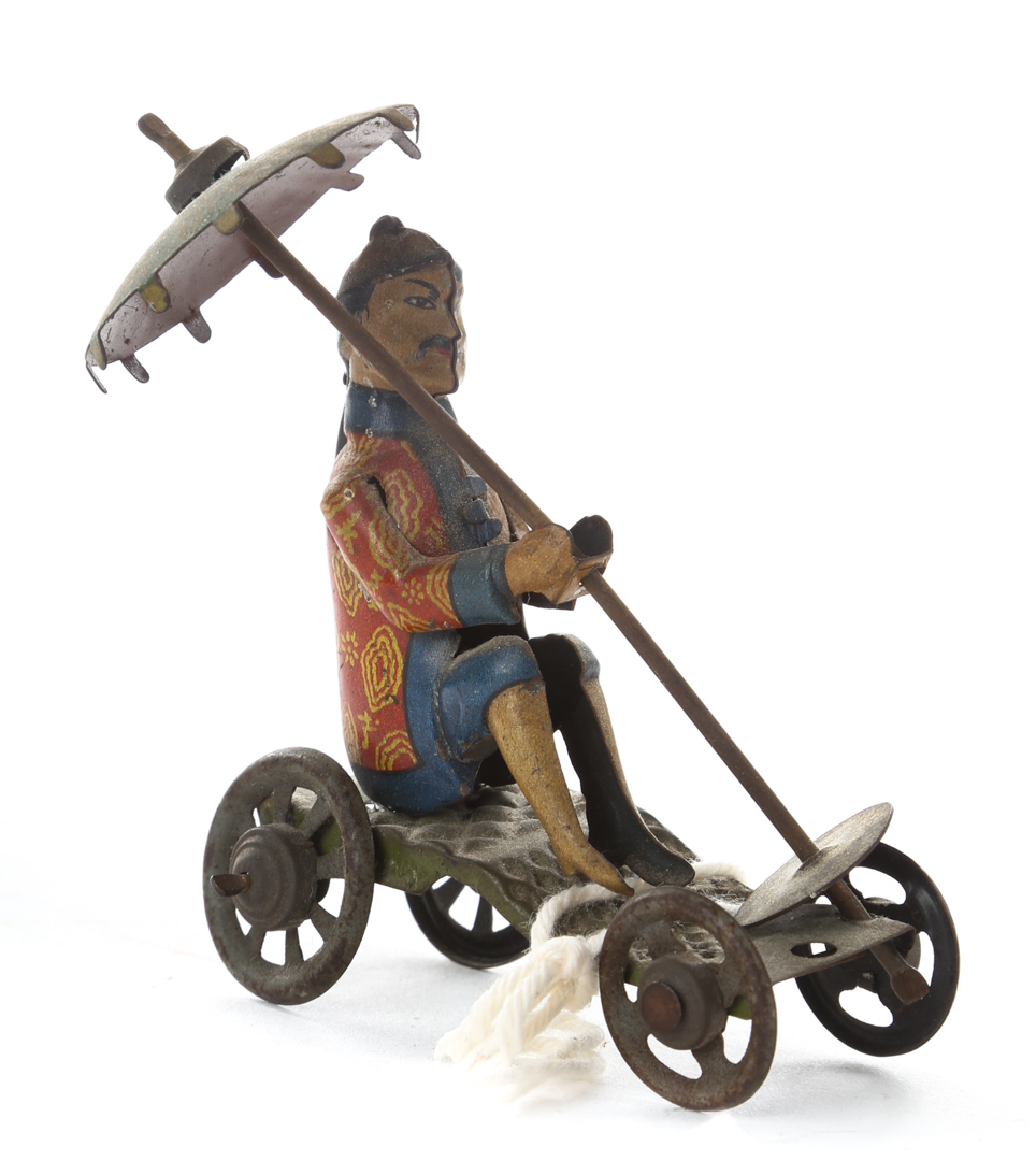 Appraisal: German litho tin scooter penny toy early th century seated