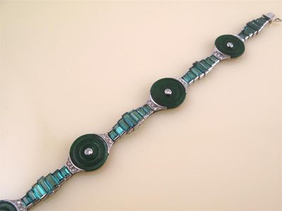 Appraisal: An Art Deco bracelet Mounted with four circular jade discs