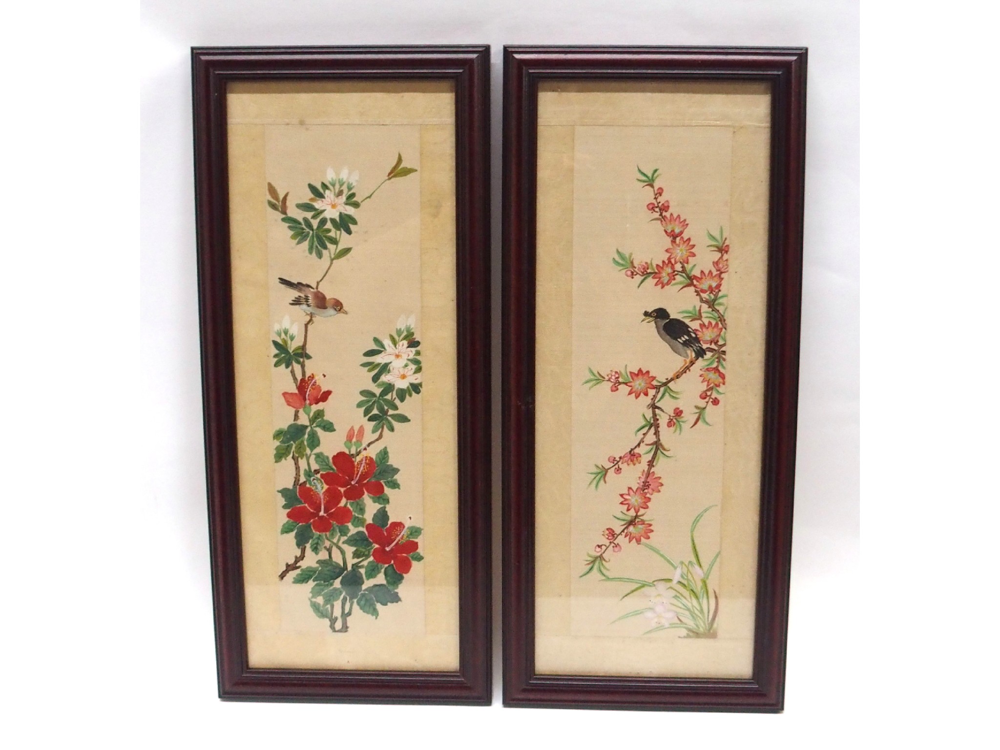 Appraisal: A pair of framed Chinese paintings of birds on flowering