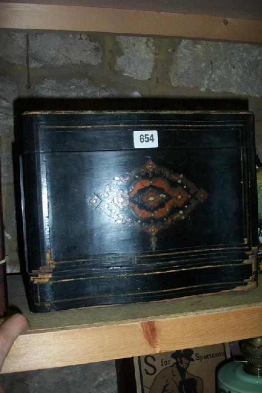 Appraisal: A th century French ebonised liquor cabinet with rising lid