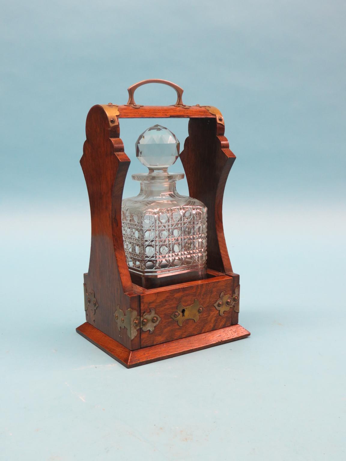 Appraisal: An unusual Victorian oak tantalus with silver plated mounts single