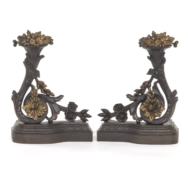 Appraisal: PAIR CAST IRON CHENETS Cornucopia forms with elaborately cast motifs