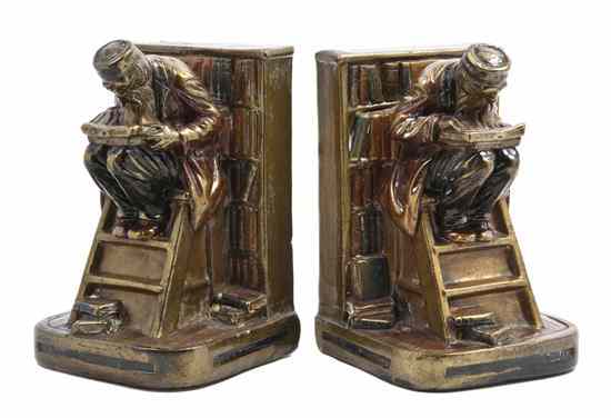 Appraisal: A Set of Bronze Clad Bookends G S H each