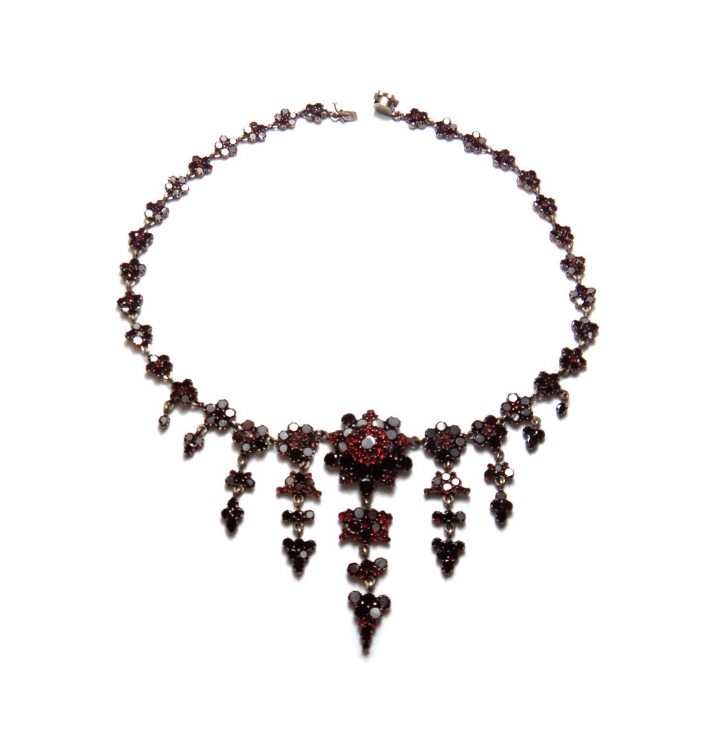 Appraisal: A Bohemian flat cut garnet set collar necklace the links