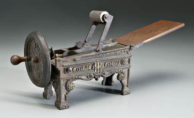 Appraisal: Cast iron German tobacco shredder footed device with roller bar