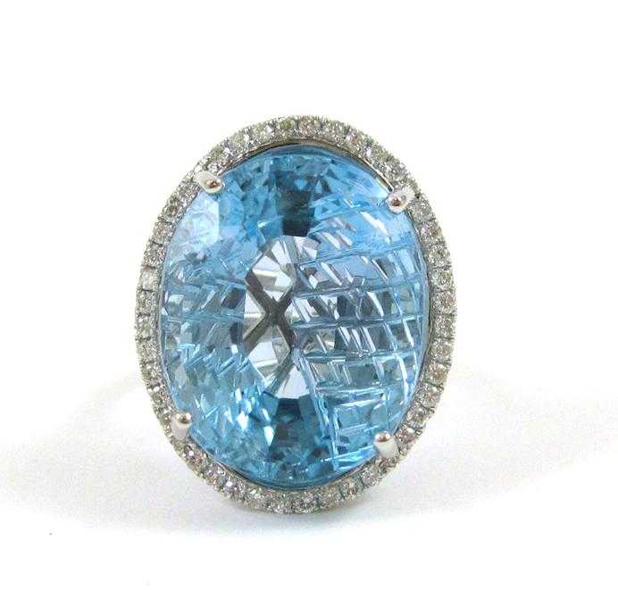 Appraisal: BLUE TOPAZ DIAMOND AND FOURTEEN KARAT GOLD RING The white