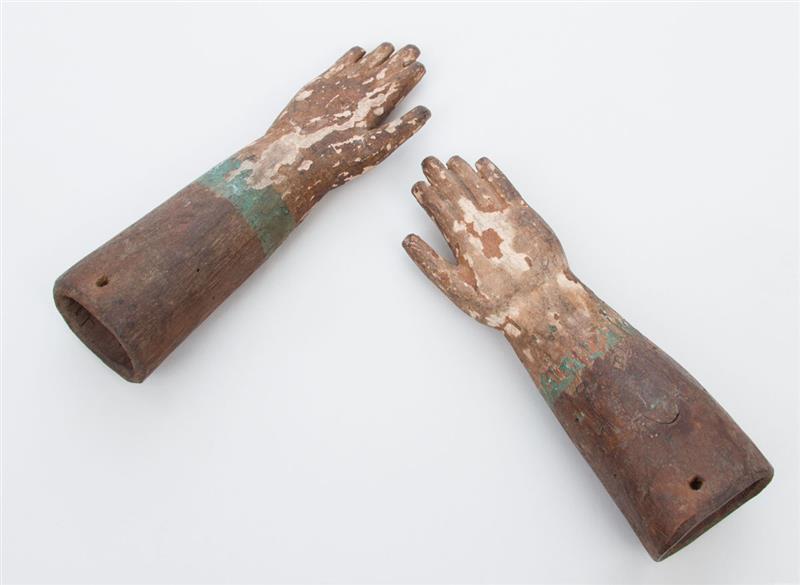 Appraisal: PAIR OF CARVED AND POLYCHROME DECORATED MODELS OF HANDS in