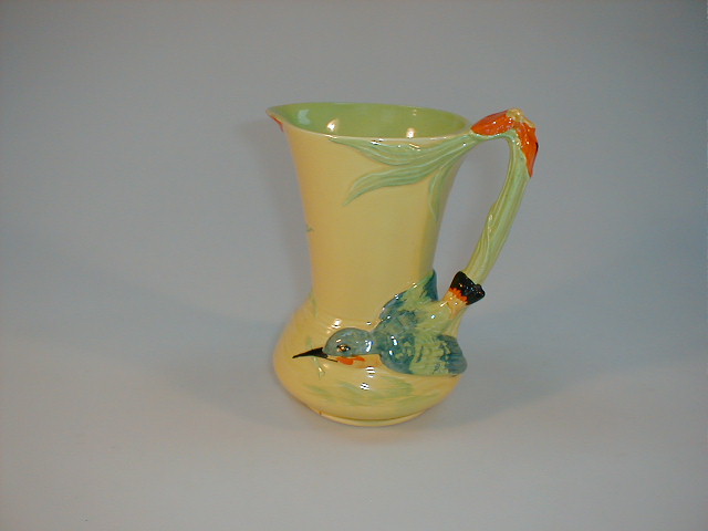 Appraisal: A Burleigh ware moulded jug with bird handle