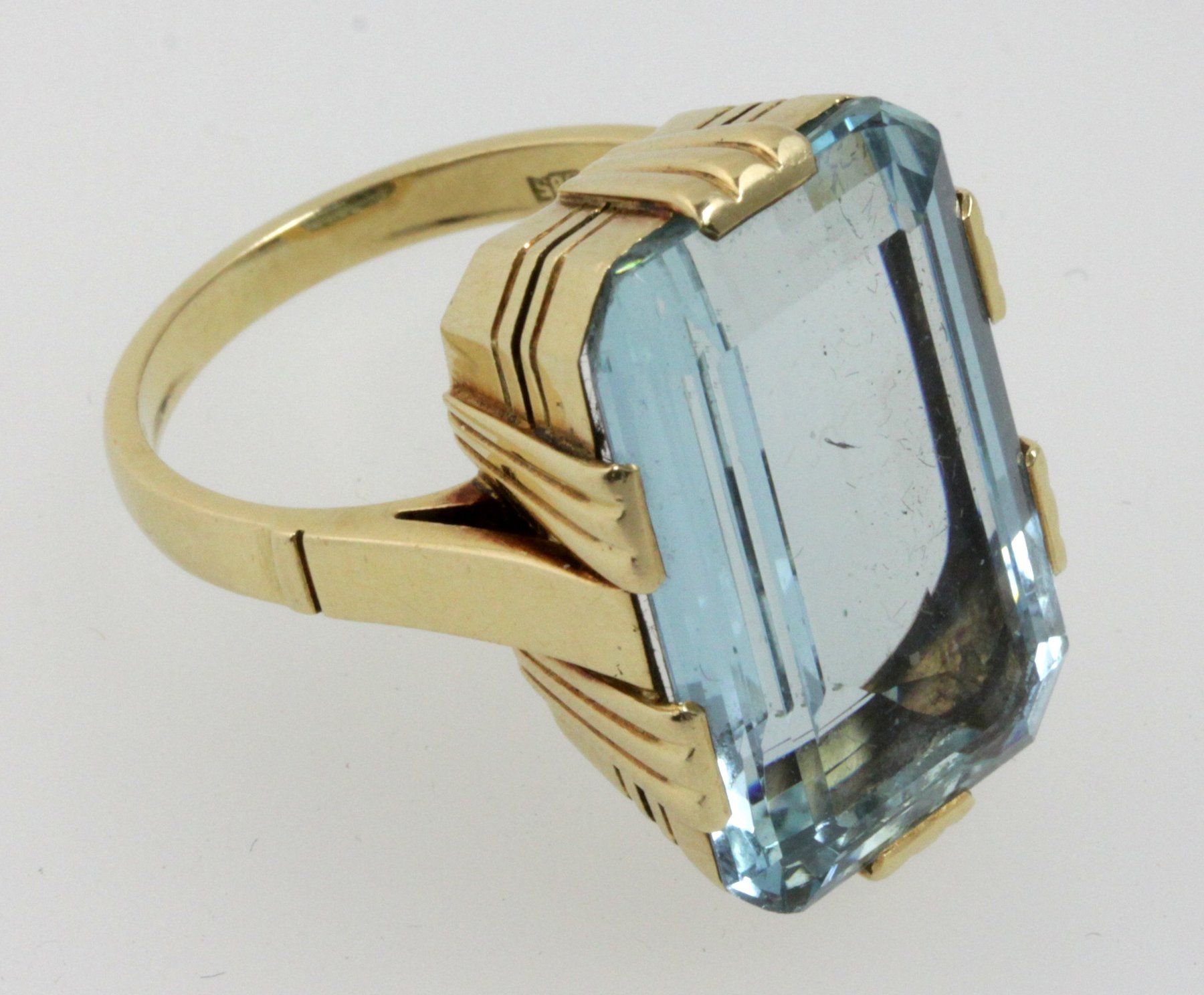 Appraisal: An aquamarine dress ring the canted rectangular stone in an