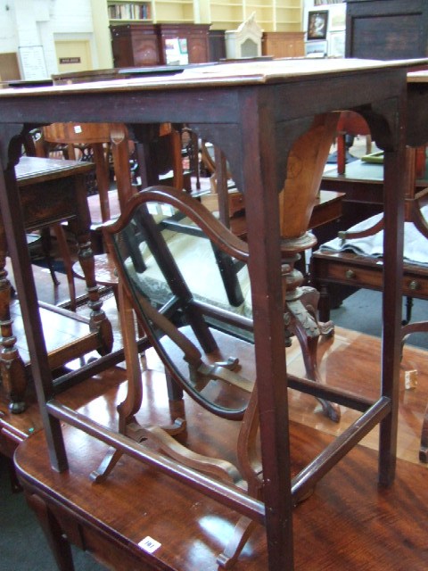 Appraisal: A th century mahogany side table raised on square supports