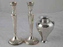 Appraisal: A silver vase ht cm and a pair of candlesticks