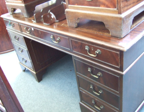 Appraisal: A th Century mahogany pedestal desk with an arrangement of