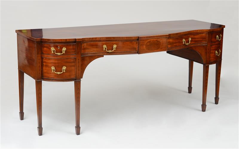 Appraisal: GEORGE III MAHOGANY SERPENTINE-FRONTED SIDEBOARD The serpentine-fronted top above a