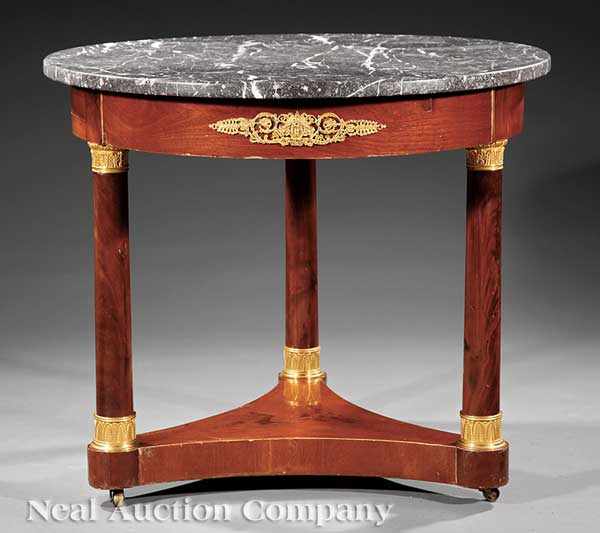 Appraisal: A Continental Empire Mahogany and Gilt Bronze-Mounted Gu ridon th