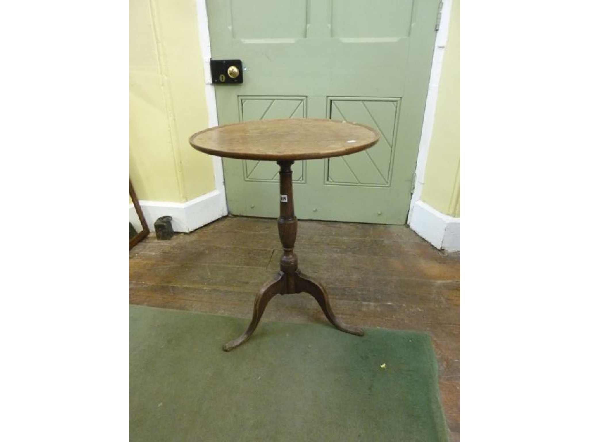 Appraisal: A Georgian oak country made occasional table the circular tray