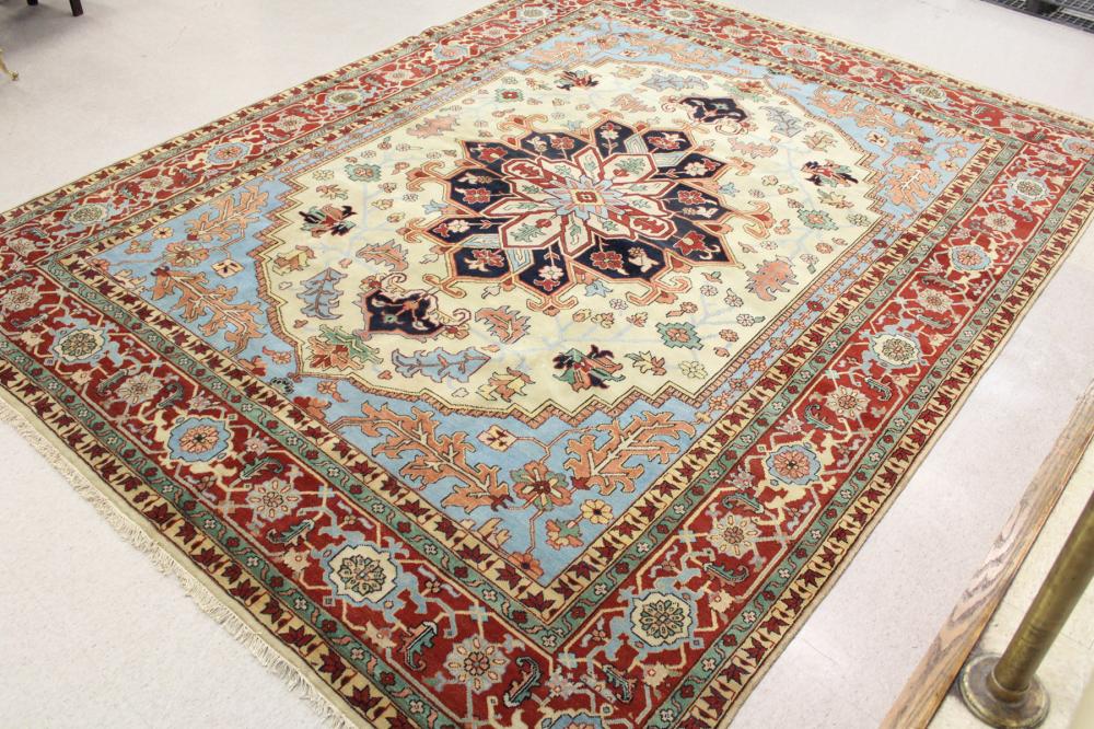 Appraisal: LARGE HAND KNOTTED ORIENTAL CARPET Persian Heriz design with central