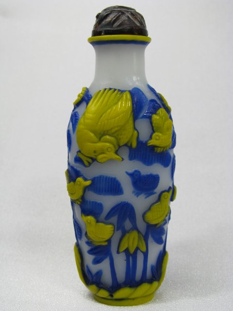 Appraisal: Unusual blue and yellow overlay of flowers rabbits and birds