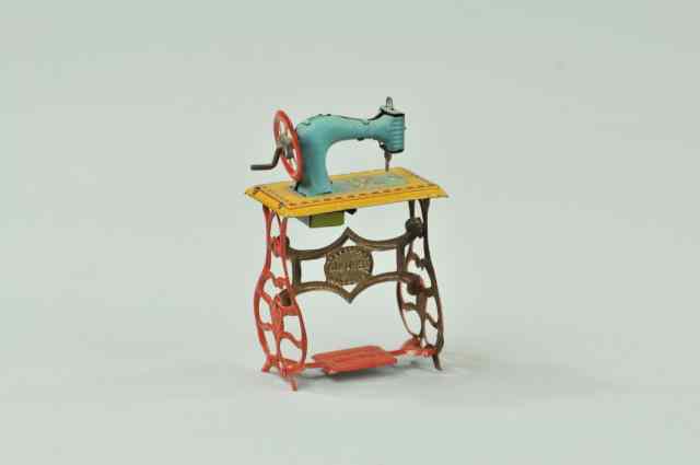 Appraisal: SEWING MACHINE PENNY TOY Meier lithographed tin toy depicts blue