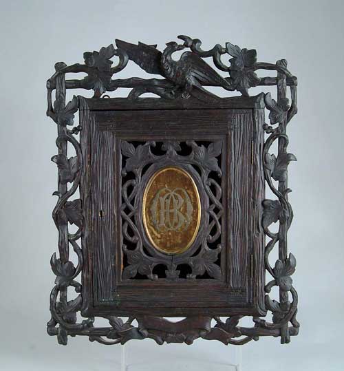 Appraisal: CARVED BLACK FOREST WALL CABINET Small wall mounted cabinet has