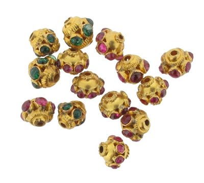 Appraisal: Fourteen gold Indian beads Some set with cabochon rubies and