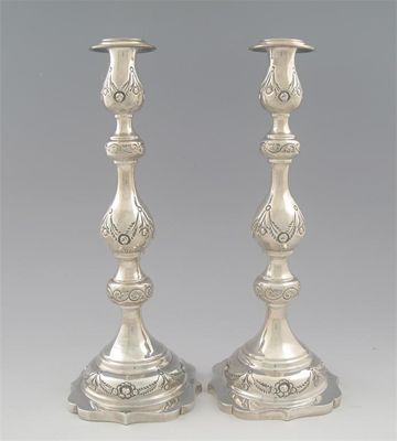 Appraisal: A pair of modern 'sabbath' candlesticks with knopped baluster columns