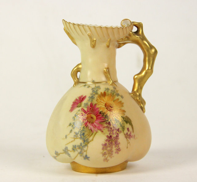 Appraisal: A Royal Worcester blush ivory cream jug of lobed form