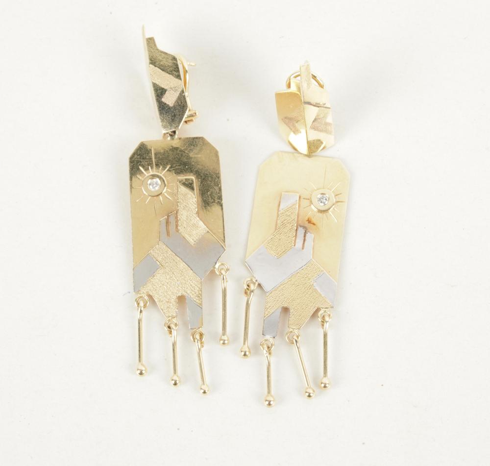 Appraisal: KARAT GOLD DIAMOND SOUTHWEST-STYLE EARRINGSthe two-tone gold earrings depicting a