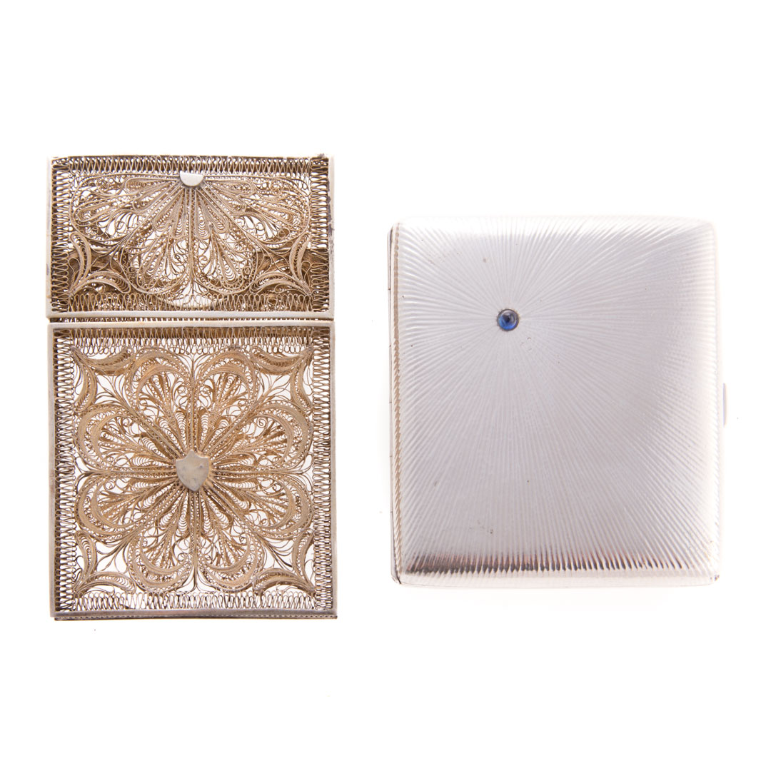 Appraisal: Continental silver cigarette and card cases German molded silver cigarette