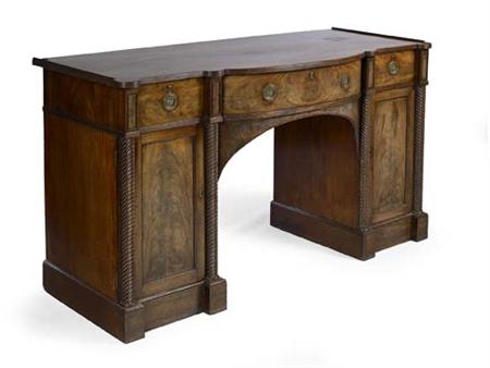 Appraisal: A late Regency mahogany sideboard of break-bowfront outline the top