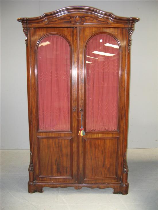 Appraisal: th Century mahogany bookcase with two glazed doors foliage carved