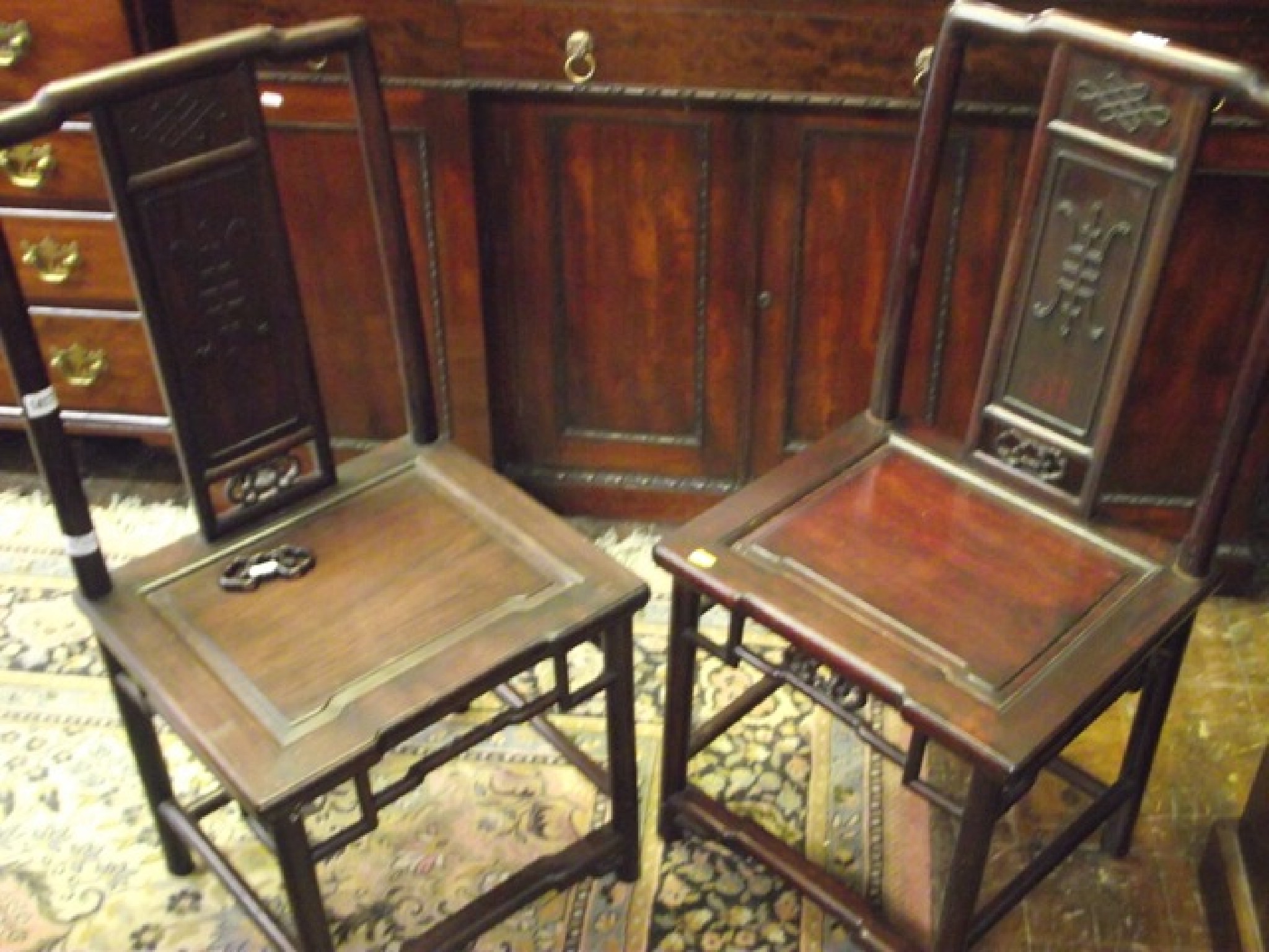 Appraisal: A pair of Chinese hardwood side or hall chairs with