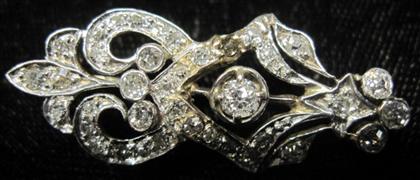 Appraisal: Platinum topped yellow gold and diamond broochSet with petite round