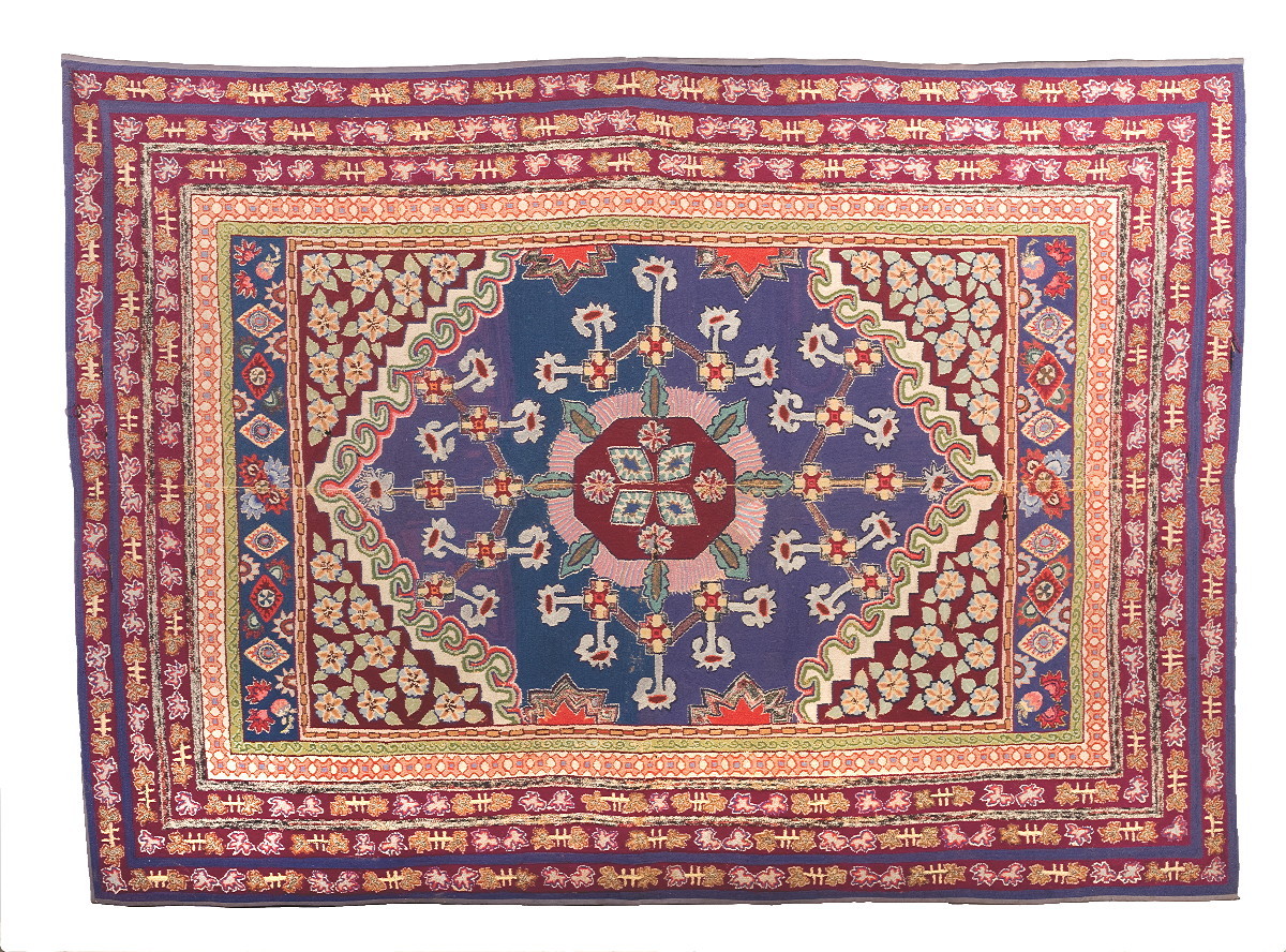 Appraisal: NEW ENGLAND ORIENTAL-STYLE HOOKED RUG CIRCA With ten geometric borders