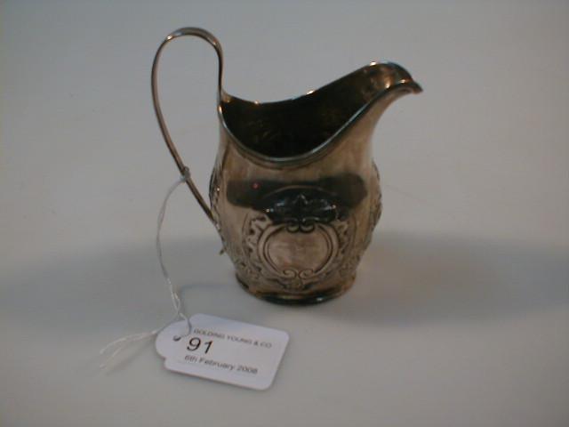 Appraisal: A George III silver helmet cream jug with a reeded