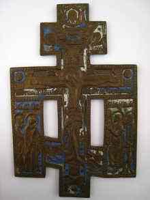 Appraisal: A large brass Russian Orthodox Crucifix with attendant figures Ht