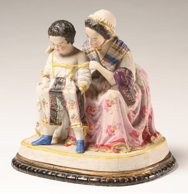 Appraisal: Unusual figural biscuit fired sewing box cover consists of brightly