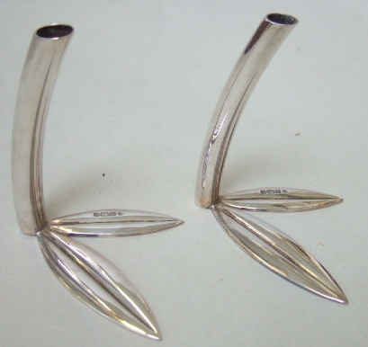 Appraisal: A pair of silver stands each with a twin leaf