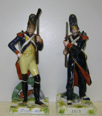 Appraisal: PAIR OF PORCELAIN NAPOELONIC SOLDIERS Each carrying a musket and